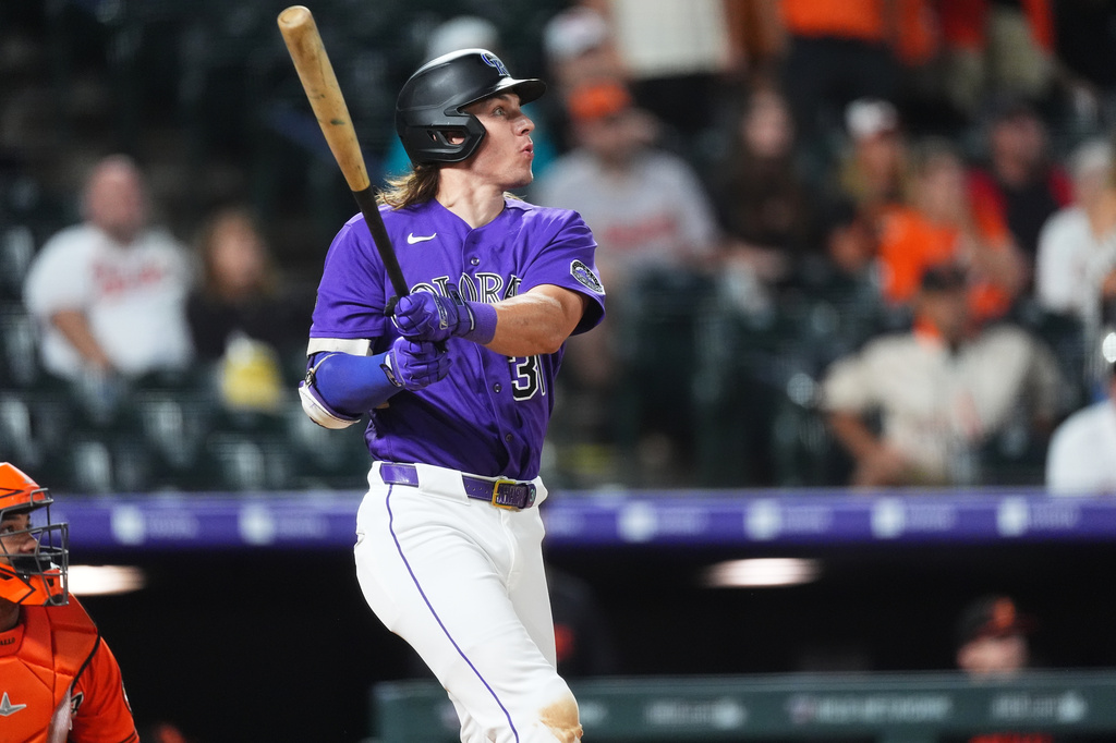 Colorado Rockies' Jake McCarthy follows the flight of his fly out to end a baseball game against the Baltimore Orioles Monday, Aug. 31, 2026, in Denver. (AP Photo/David Zalubowski)