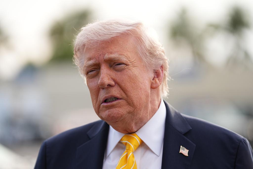 President Donald Trump talks to reporters before he boards Air Force One at Palm Beach International Airport in West Palm Beach, Fla., Saturday May 2, 2026, en route Miami. (AP Photo/Matt Rourke)