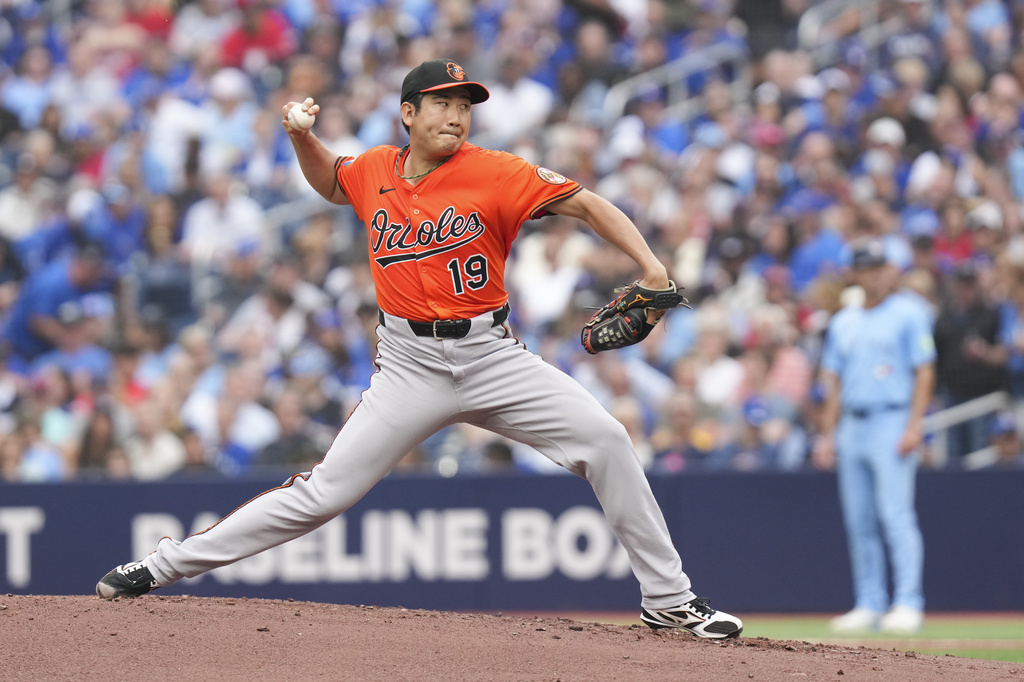 Baltimore Orioles pitcher Tomoyuki Sugano (19) works against Toronto Blue Jays during the first inning of a baseball game, Saturday, Sept. 13, 2025, in Toronto. (Chris Young/The Canadian Press via AP)