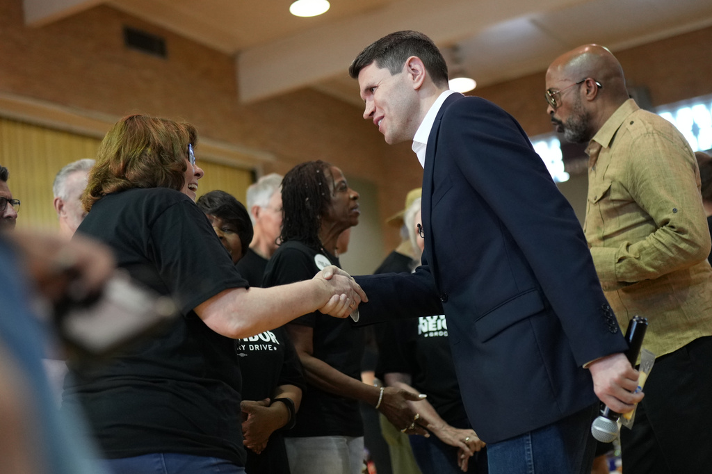 Democratic U.S. Senate candidate Texas state Rep. James Talarico talks with volunteers at a food drive at the Frederick Douglass Human Services and Justice Center, Wednesday, Sept. 9, 2026, in Dallas. (AP Photo/Julia Demaree Nikhinson)