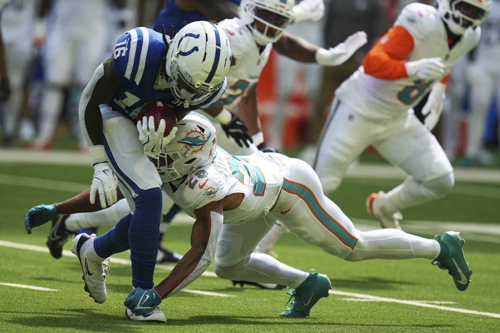 Indianapolis Colts wide receiver Ashton Dulin (16) is tackled by Miami Dolphins safety Minkah Fitzpatrick (29) on kickoff during the first half of an NFL football game Sunday, Sept. 7, 2025, in Indianapolis. (AP Photo/Darron Cummings)