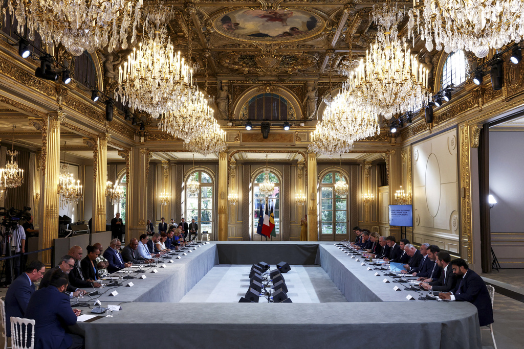 President Emmanuel Macron attends a meeting with New Caledonia's elected officials and state representatives for an agreement aimed at granting more autonomy to the South Pacific territory, at the Elysee Palace in Paris, France, Saturday, July 12, 2025. (Tom Nicholson/Pool Photo via AP)