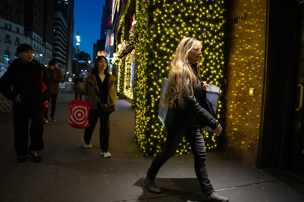 Black Friday Shoppers arrive to Macy's flagship store in New York on Friday, Nov. 28, 2025. (AP Photo/Angelina Katsanis)