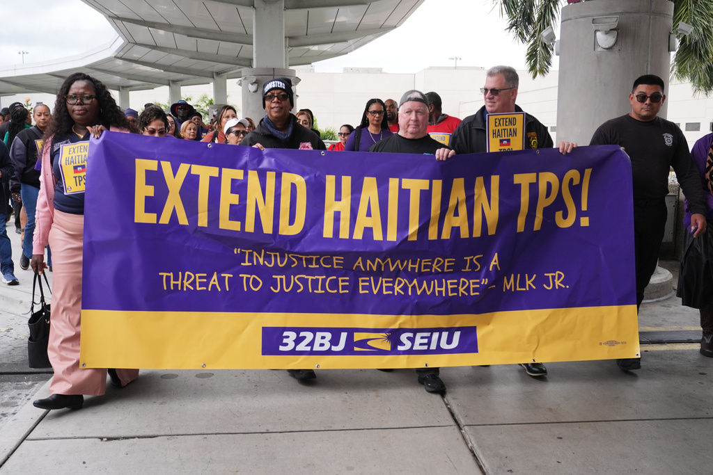 People march during a rally in support of the extension of Temporary Protected Status (TPS) for Haitian immigrants before it expires on February 3, Wednesday, Jan. 28, 2026, in Fort Lauderdale, Fla. (AP Photo/Lynne Sladky)