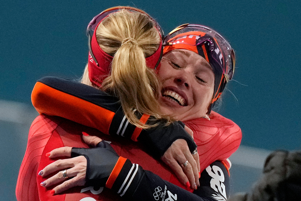 Gold medallist Antoinette Rijpma-de Jong of the Netherlands, right, is congratulated by silver medallist Ragne Wiklund of Norway after the women's 1500 meters speedskating race at the 2026 Winter Olympics, in Milan, Italy, Friday, Feb. 20, 2026. (AP Photo/Luca Bruno)