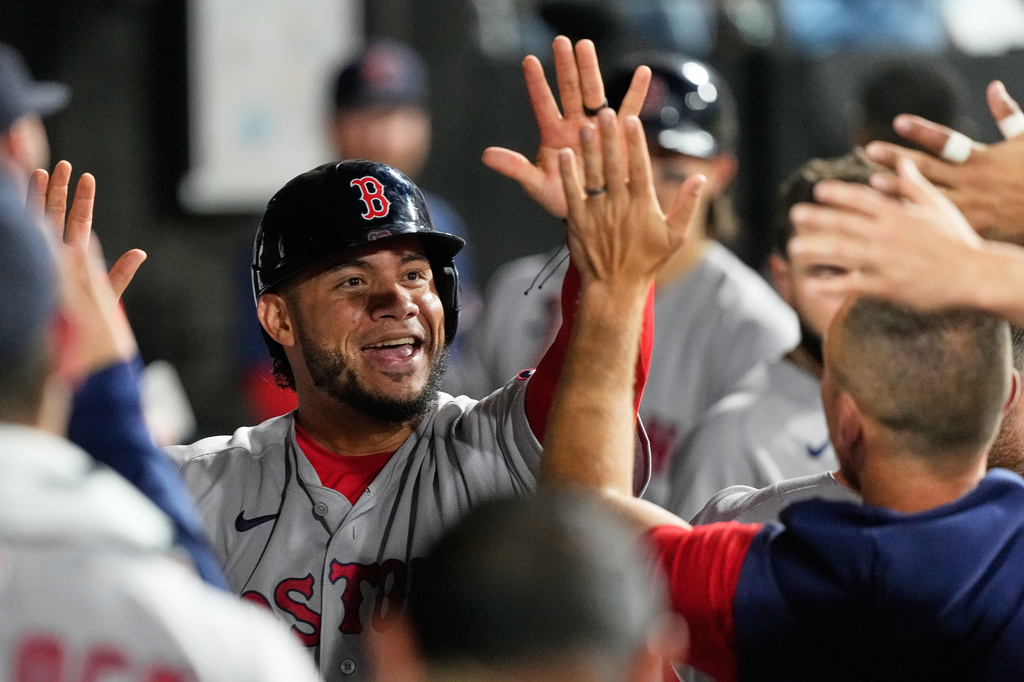 Boston Red Sox's Willson Contreras celebrates with teammates after scoring on a one-run double by Romy Gonzalez during the ninth inning of a baseball game against the Chicago White Sox in Chicago, Tuesday, July 7, 2026. (AP Photo/Nam Y. Huh)