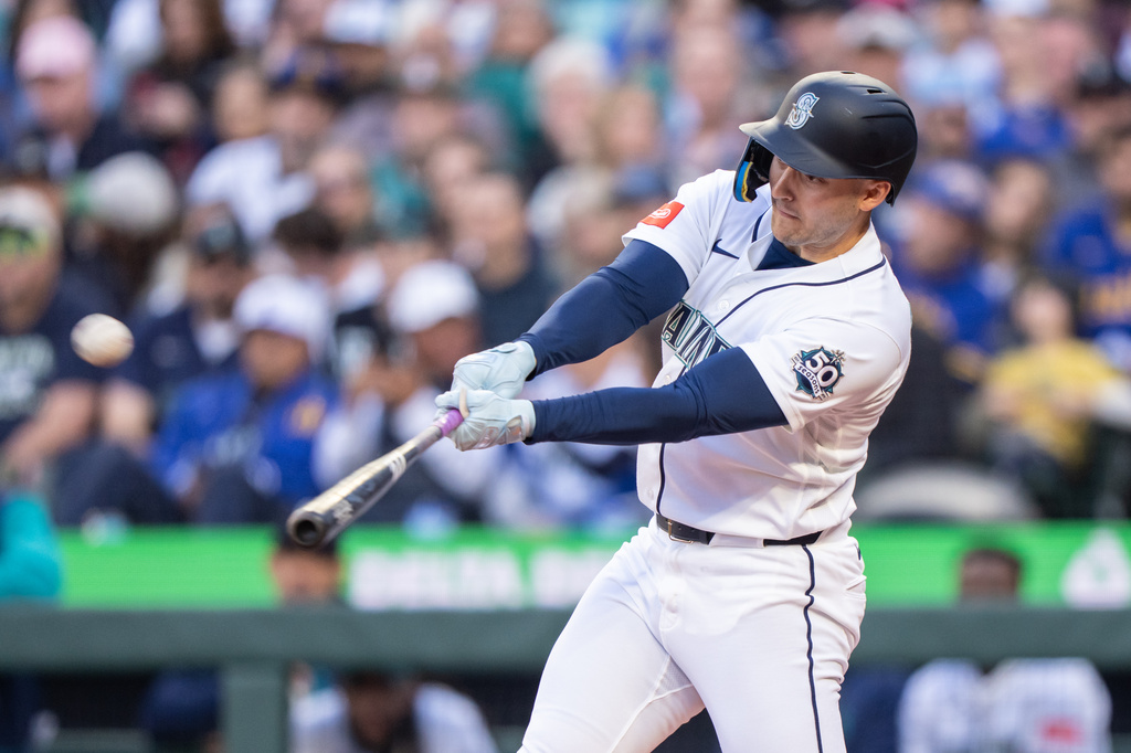 Seattle Mariners' Dominic Canzone hits a solo home run during the second inning of a baseball game against the Arizona Diamondbacks, Saturday, May 30, 2026, in Seattle. (AP Photo/Stephen Brashear)