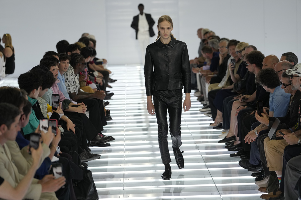 A model wears a creation from Prada's Spring/Summer 2027 men's collection presented in Milan, Italy, Sunday, June 21, 2026. (AP Photo/Luca Bruno)