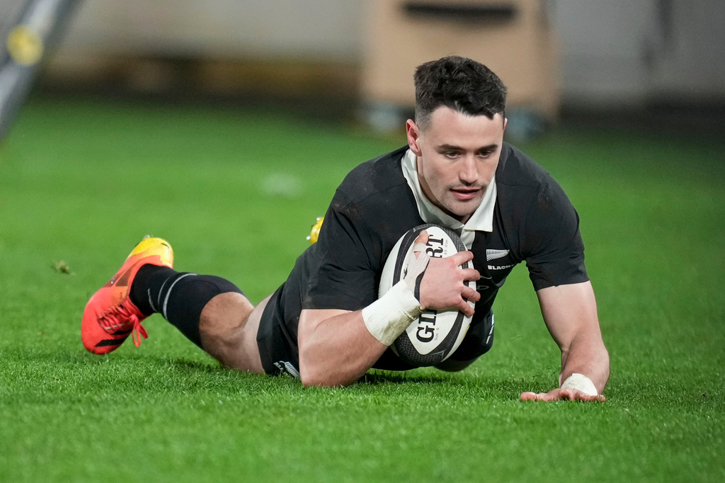 New Zealand's Will Jordan scores a try during the Nations Championship rugby international between the All Blacks and Italy in Wellington, New Zealand, Saturday, July 11, 2026. (Marty Melville/Photosport via AP)