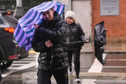 Two people battle gusts with their umbrellas as they fight a wind-driven rain storm, Monday, Oct. 13, 2025, in Boston. (AP Photo/Charles Krupa) Two people battle gusts with their umbrellas as they fight a wind-driven rain storm, Monday, Oct. 13, 2025, in Boston. (AP Photo/Charles Krupa)