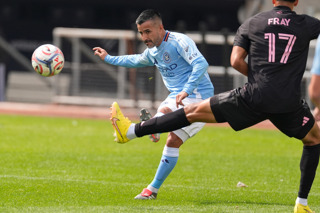 New York City FC's Maximiliano Moralez, left, moves the ball up the field during the first half of an MLS soccer game against Inter Miami at Yankee Stadium in New York, Sunday, March 22, 2026. (AP Photo/Seth Wenig)
