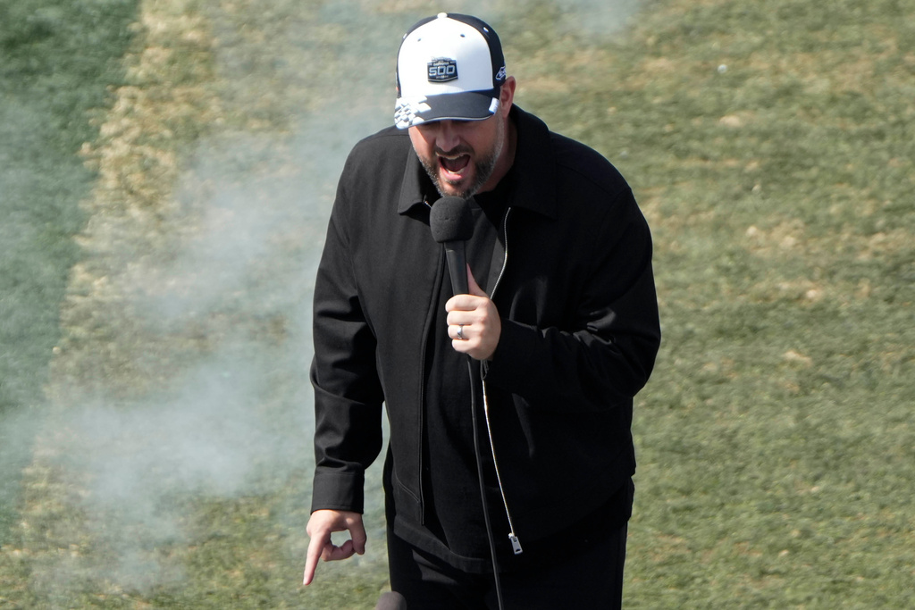 Comedian Nate Bargatze announce the start of the race during the NASCAR Daytona 500 auto race at Daytona International Speedway, Sunday, Feb. 15, 2026, in Daytona Beach, Fla. (AP Photo/John Raoux)