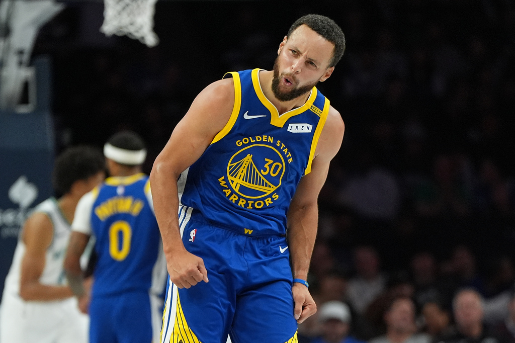 Golden State Warriors guard Stephen Curry (30) celebrates after making a 3-point shot during the first half of an NBA basketball game against the Minnesota Timberwolves, Wednesday, Oct. 28, 2026, in Minneapolis. (AP Photo/Abbie Parr)