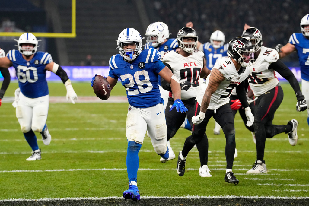 Indianapolis Colts running back Jonathan Taylor (28) scores a touchdown during overtime in an NFL football game against the Atlanta Falcons, Sunday, Nov. 9, 2025, in Berlin, Germany. (AP Photo/Martin Meissner)