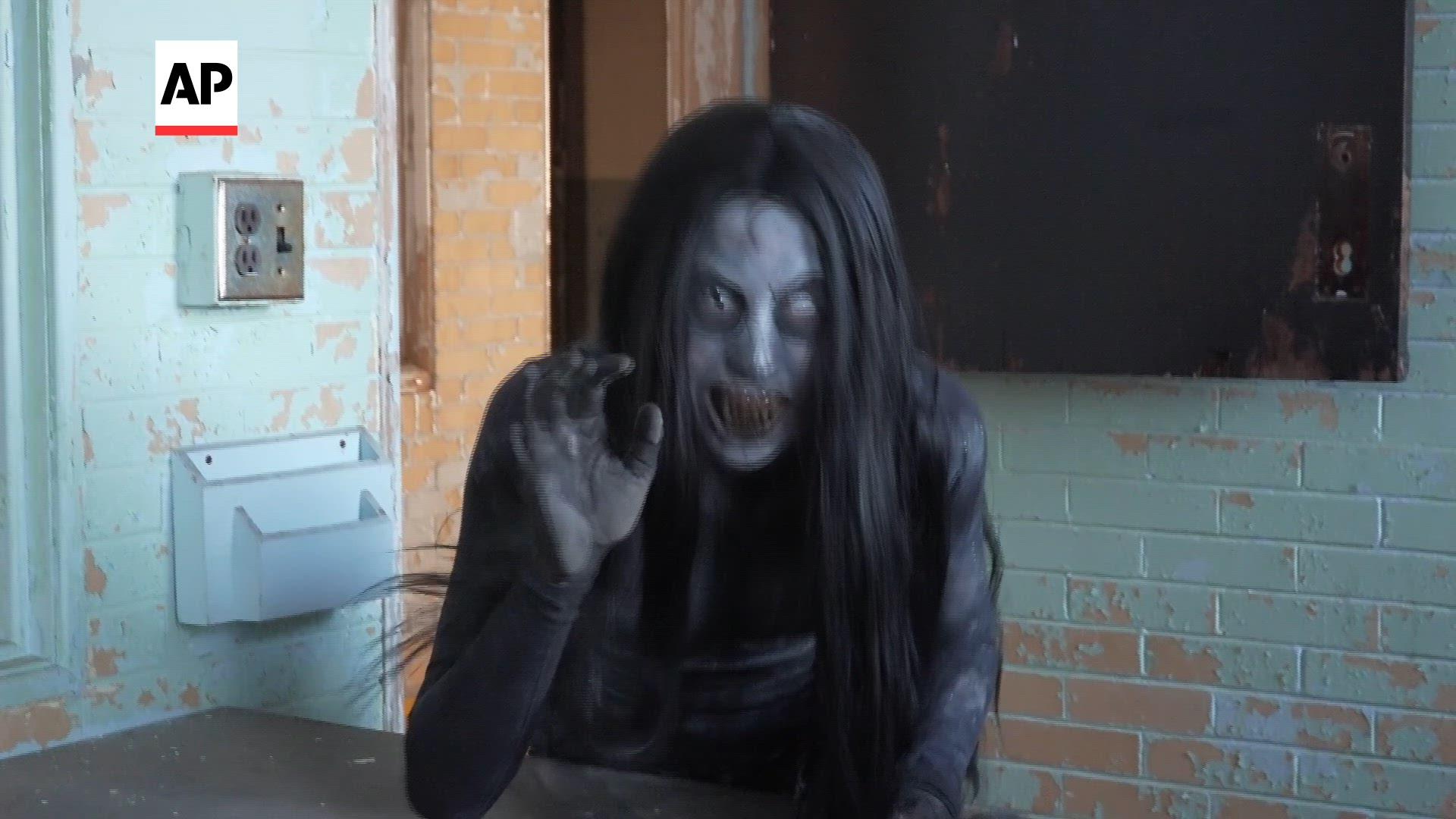Haunted attractions are taking Halloween to another level, offering paranormal investigations and overnight stays at a former psychiatric hospital and a funeral home &mdash; with one even hosting weddings. (AP video by Mike Householder)
