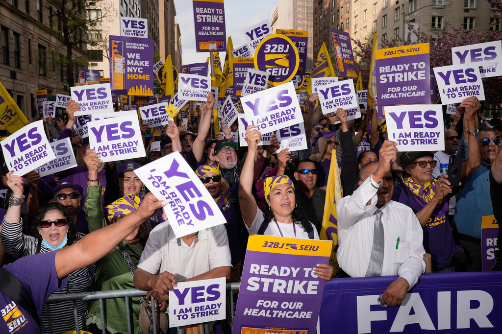 Members of the 32BJ SEIU union vote to authorize a strike during a rally on Park Avenue, in New York, Wednesday, April 15, 2026. (AP Photo/Seth Wenig)