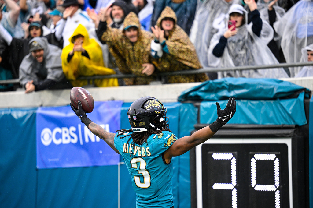 Jacksonville Jaguars wide receiver Jakobi Meyers (3) celebrates a touchdown against the Indianapolis Colts during the first half of an NFL football game, Sunday, Dec. 7, 2025, in Jacksonville, Fla. (AP Photo/Phelan M. Ebenhack)