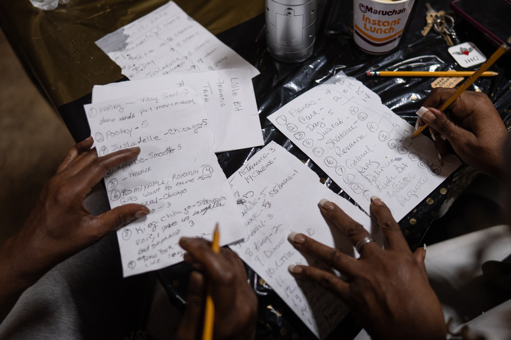 Judges compare notes while deciding the winners of the Skid Row's inaugural talent show in downtown Los Angeles, Saturday, Sept. 19, 2026. (AP Photo/Jae C. Hong)