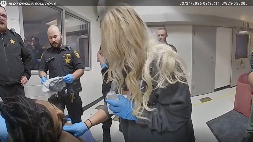 This image taken from video released by the Montgomery County Sheriff's Office shows law enforcement giving aid to Christian Black inside the Montgomery County Jail on March 24, 2025, in Dayton, Ohio. (Montgomery County Sheriff's Office via AP)