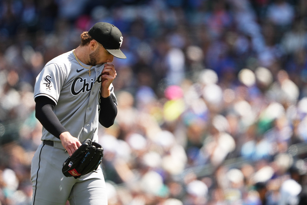 Chicago White Sox starting pitcher Sean Burke walks back to the dugout after the fourth inning of a baseball game against the Seattle Mariners, Wednesday, May 20, 2026, in Seattle. (AP Photo/Lindsey Wasson)