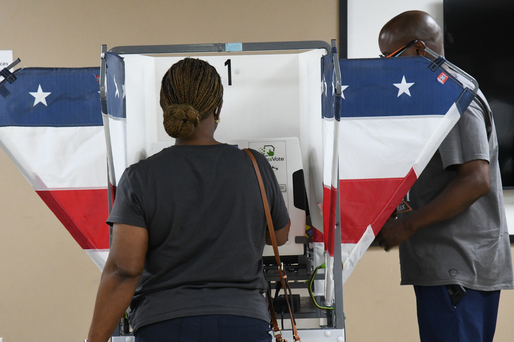 Two voters fill out their ballots in Memphis, Tenn., Wednesday, July 22, 2026. (AP Photo/Kristin M. Hall)