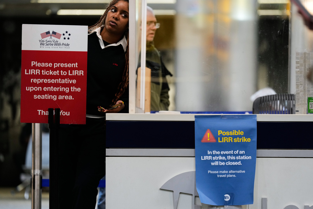 A sign warns commuters of a potential Long Island Rail Road strike at Penn Station in New York, Thursday, May 14, 2026. (AP Photo/Seth Wenig)