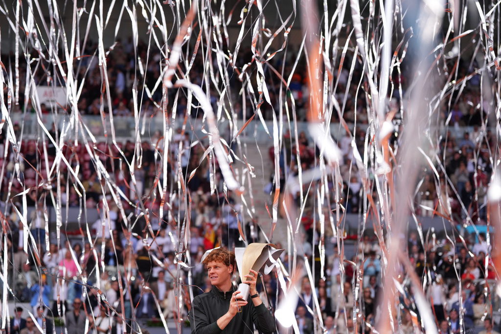 Jannik Sinner, of Italy, holds the trophy after winning the men's singles tennis final match against Alexander Zverev, of Germany, at the Madrid Open tennis tournament in Madrid, Spain, Sunday, May 3, 2026. (AP Photo/Manu Fernandez)