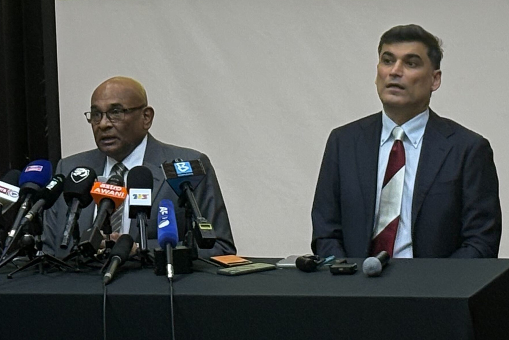AFC General Secretary Windsor John, left, with his deputy Vahid Kardany, speaks at a news conference near Kuala Lumpur, Monday, March 16, 2026. (AP Photo/Eileen Ng)