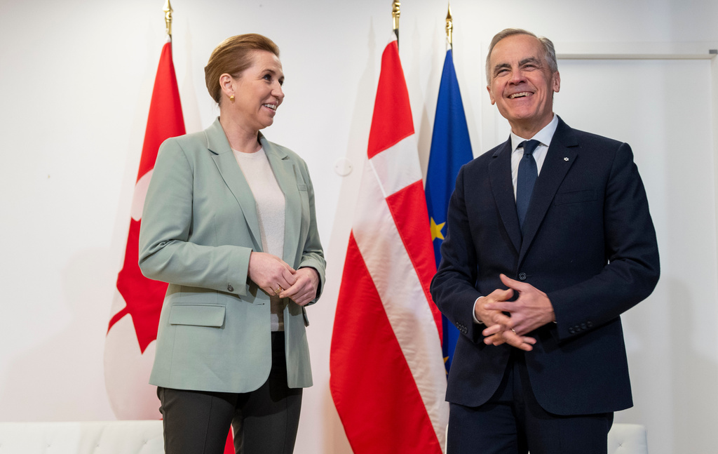 Canadian Prime Minister Mark Carney, right, takes part in a bilateral meeting with Prime Minister of Denmark Mette Frederiksen, at the Canadian Embassy in Paris, France, Tuesday, Jan. 6, 2026. (Christinne Muschi/The Canadian Press via AP)