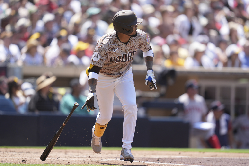 San Diego Padres' Luis Arraez watches his two-RBI double during the third inning of a baseball game against the Boston Red Sox Sunday, Aug. 10, 2025, in San Diego. (AP Photo/Gregory Bull)