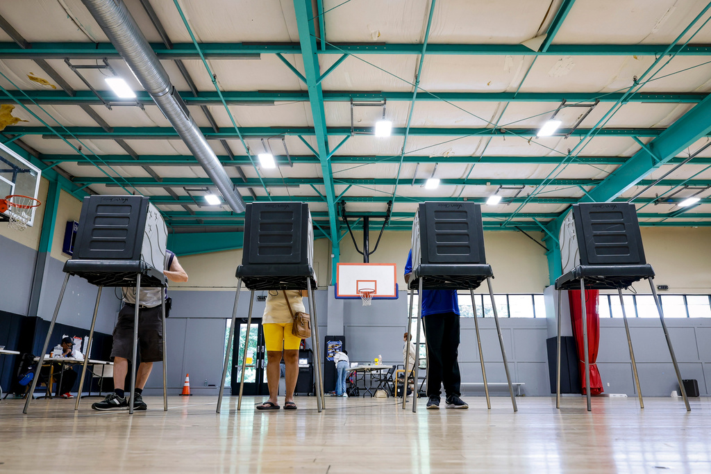 FILE - Voters cast their ballots during the primary election in Windsor, Conn., Aug. 11, 2026. (AP Photo/Rusty Jones, File)