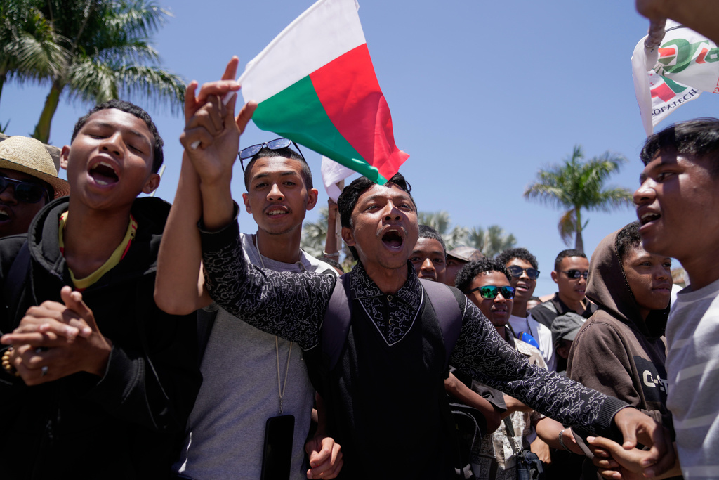 Protesters shout during a protest calling for President Andry Rajoelina to step down in Antananarivo, Madagascar, Tuesday, Oct. 14, 2025. (AP Photo/Brian Inganga)