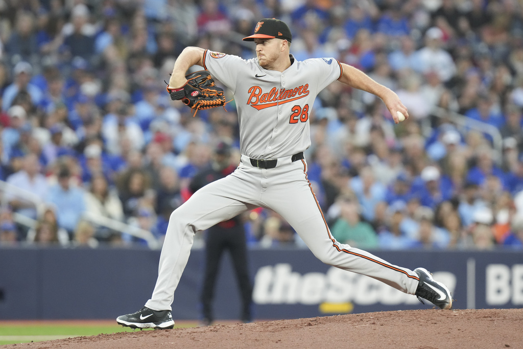Baltimore Orioles pitcher Trevor Rogers (28) works against the Toronto Blue Jays during first inning MLB baseball action in Toronto, Friday Sept. 12, 2025. (Chris Young/The Canadian Press via AP)