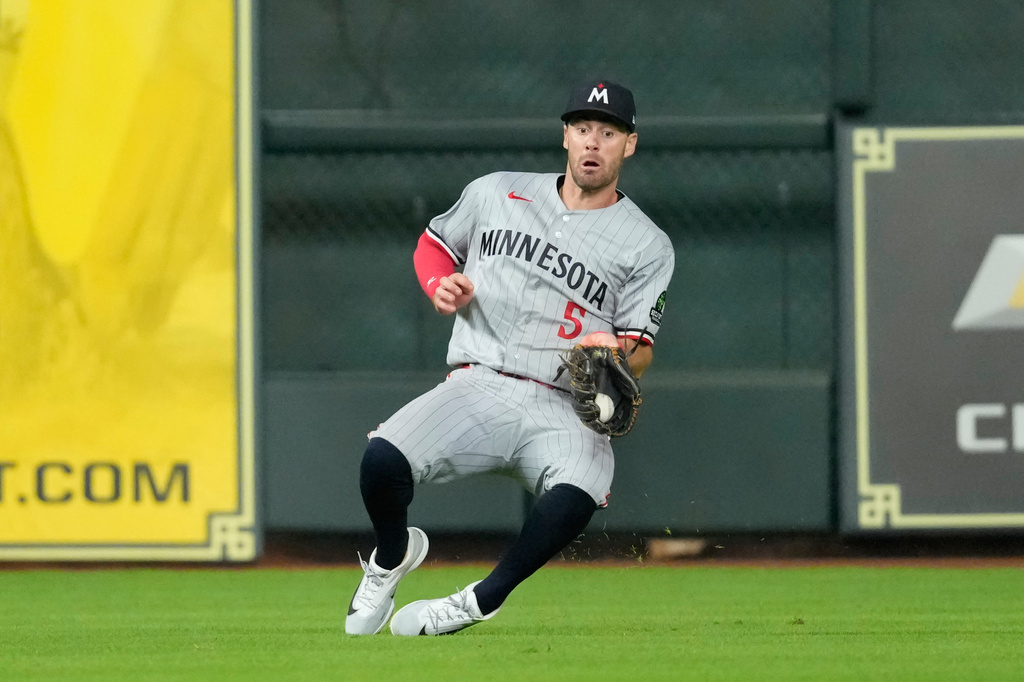 Minnesota Twins center fielder Ryan Kreidler catches a fly ball by Houston Astros' Isaac Paredes during the seventh inning of a baseball game Tuesday, June 30, 2026, in Houston. (AP Photo/David J. Phillip)