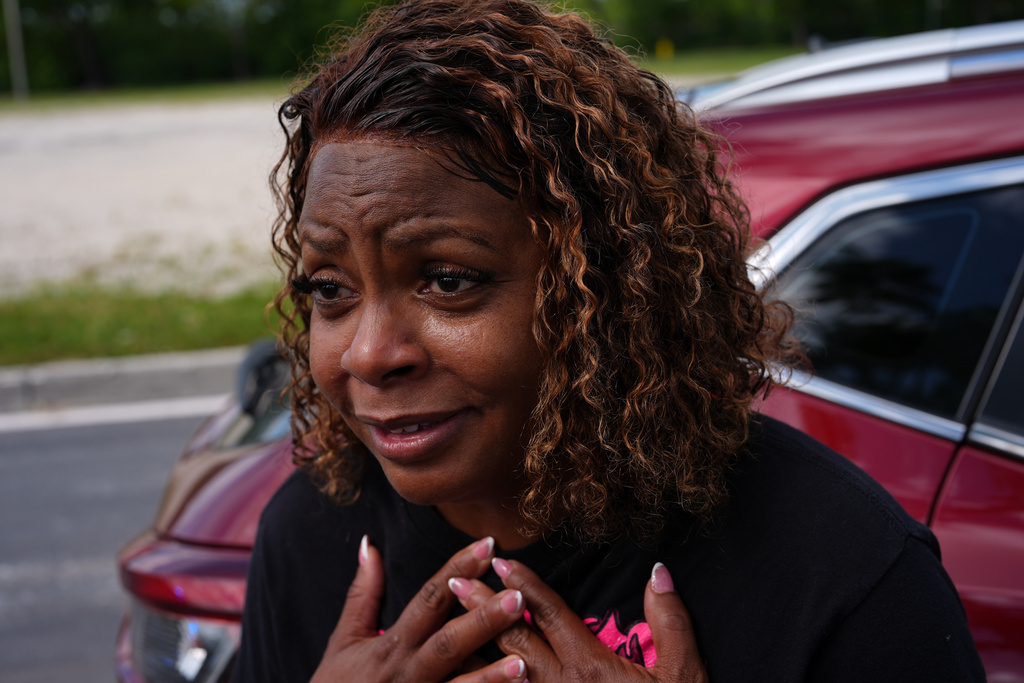 FILE - Tammy Norton, a furloughed federal employee of 16 years who currently works for the Internal Revenue Service, reacts with emotion as she talks about running through her limited savings to support her family during the government shutdown, at a food distribution center for federal employees impacted by the government shutdown, Oct. 28, 2025, in Dania Beach, Fla. (AP Photo/Rebecca Blackwell, File)