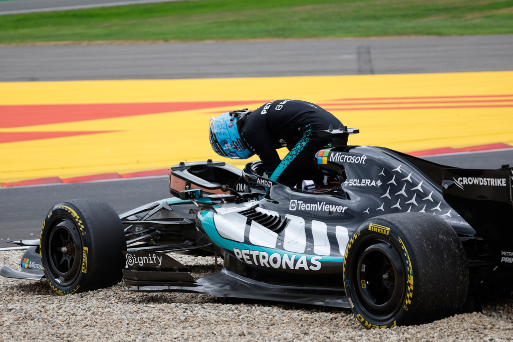 Mercedes driver George Russell of Britain gets out of his car after going off the track during the Formula One Grand Prix at the Spa-Francorchamps racetrack in Spa, Belgium, Sunday, July 19, 2026. (AP Photo/Geert Vanden Wijngaert)