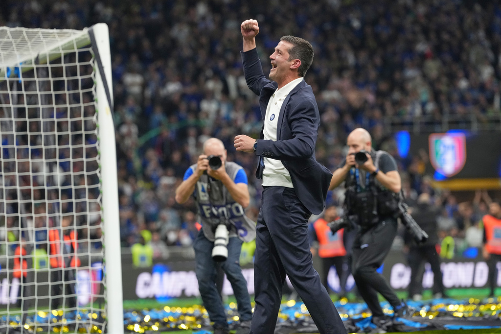 Inter Milan's head coach Cristian Chivu celebrates their victory at the Serie A soccer match between Inter Milan and Parma, in Milan, Italy, Sunday, May 3, 2026. (AP Photo/Luca Bruno)