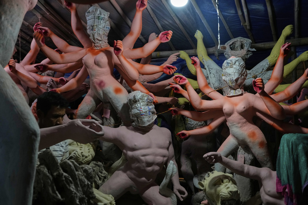 Idols of Hindu gods and goddesses are prepared ahead of the Durga Puja festival in New Delhi, India, Friday, Sept. 19, 2025. (AP Photo/Manish Swarup)