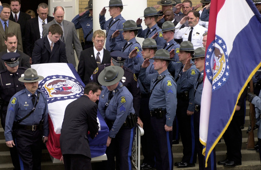 FILE - Members of the Missouri State Highway Patrol salute the body of fellow officer Sgt. Carl ''Dewayne'' Graham Jr., after funeral services March 24, 2005, in Dexter, Mo. (AP Photo/Bill Boyce, File) FILE - Members of the Missouri State Highway Patrol salute the body of fellow officer Sgt. Carl ''Dewayne'' Graham Jr., after funeral services March 24, 2005, in Dexter, Mo. (AP Photo/Bill Boyce, File)