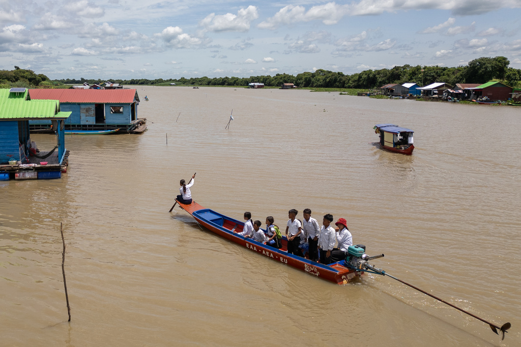 Students from a floating village on Cambodia's Tonle Sap Lake return to their homes in a school boat on Monday, June 29, 2026. (AP Photo/Anton L. Delgado)