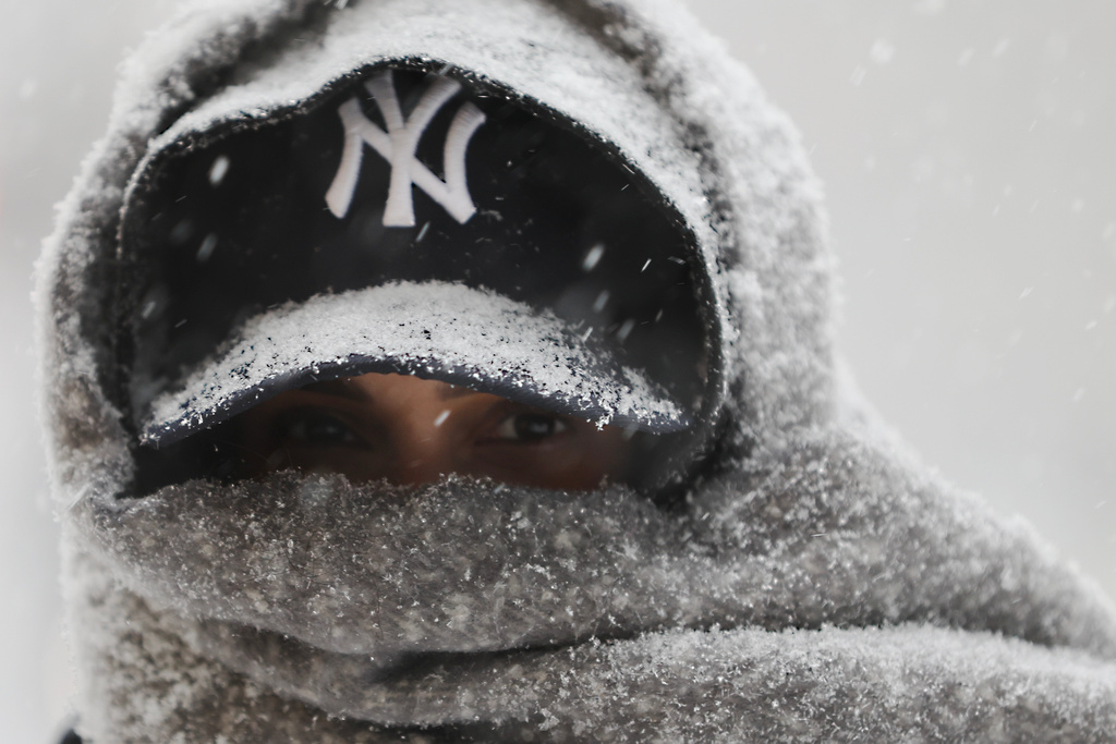 Abrar Omar walks through Manhattan during a winter storm, Sunday, Jan. 25, 2026, in New York. (AP Photo/Heather Khalifa)