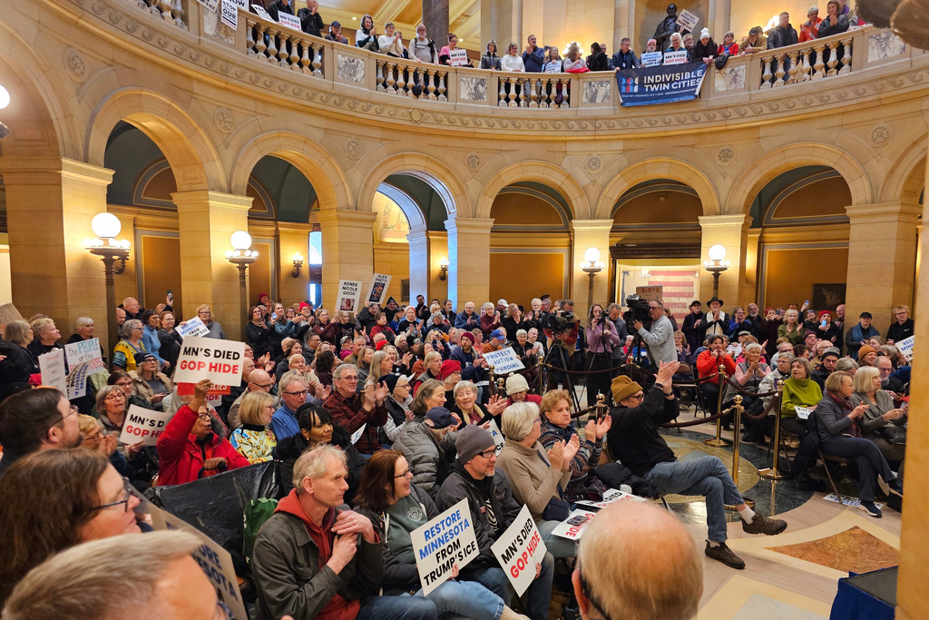 Hundreds of people attend a rally in the rotunda of the Minnesota State Capitol in St. Paul, Minn., Wednesday, Feb. 18, 2026, to urge leaders to support economic recovery in the wake of the Trump administration's immigration crackdown in the state. (AP Photo/Steve Karnowski)