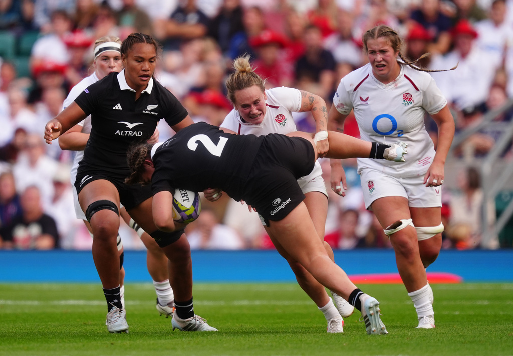 New Zealand's Georgia Ponsonby is tackled by England's Megan Jones during the WXV Global Series match between England and New Zealand in London, Saturday Sept. 26, 2026. (David Davies/PA via AP)