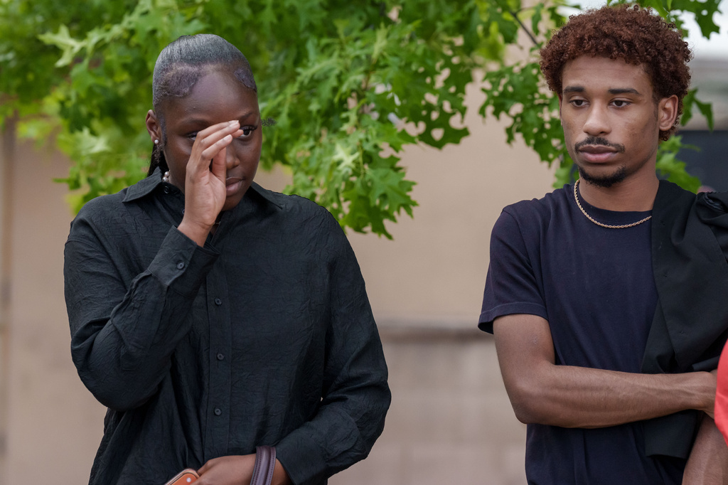 People react after a mass shooting at the Mall of Louisiana, Thursday, April 23, 2026, in Baton Rouge, La. (AP Photo/Matthew Hinton)