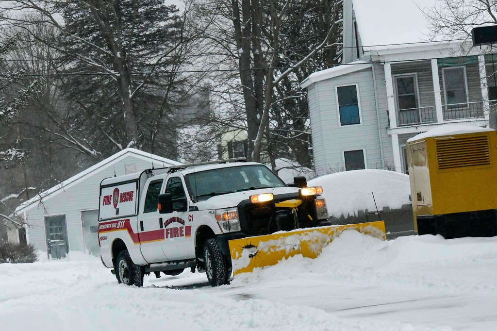 Rockingham, Vt., Fire Chief Shaun McGinnis removes snow from the Police/Fire Station on Monday, Jan. 26, 2026, after Winter Storm Fern dropped several inches of snow. (Kristopher Radder/The Brattleboro Reformer via AP)