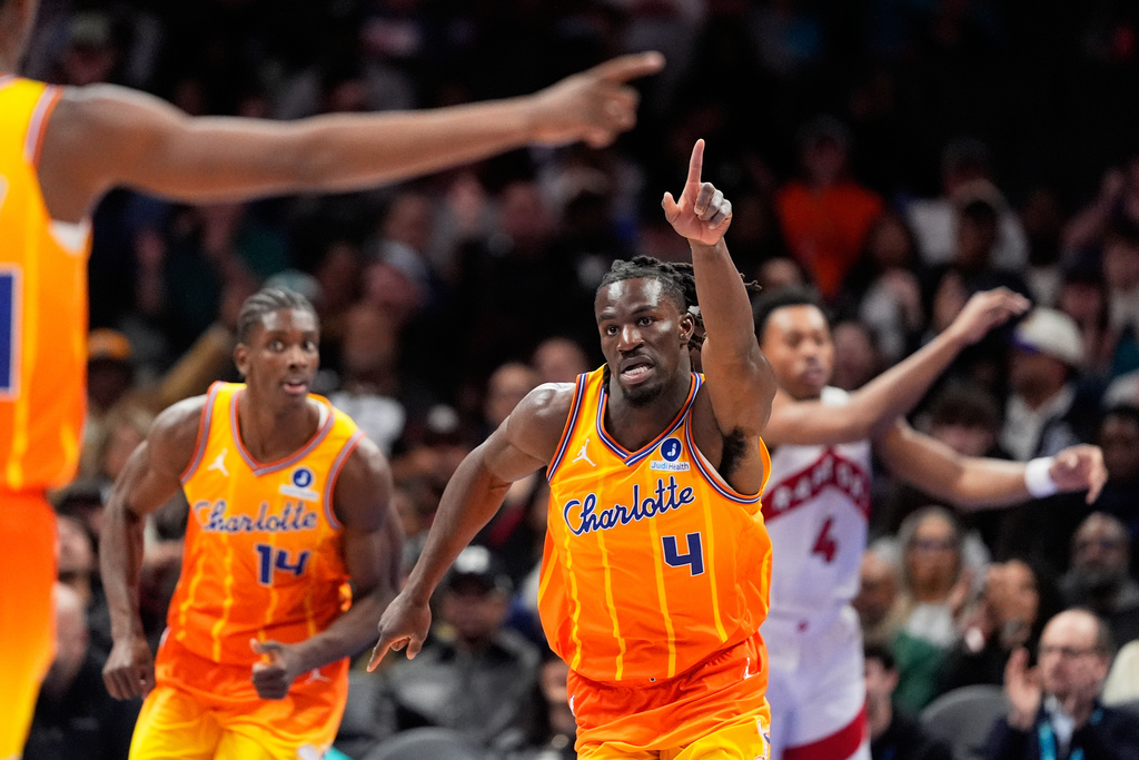 Charlotte Hornets guard Sion James celebrates after scoring against the Toronto Raptors during the first half of an NBA basketball game, Saturday, Nov. 29, 2025, in Charlotte, N.C. (AP Photo/Chris Carlson)