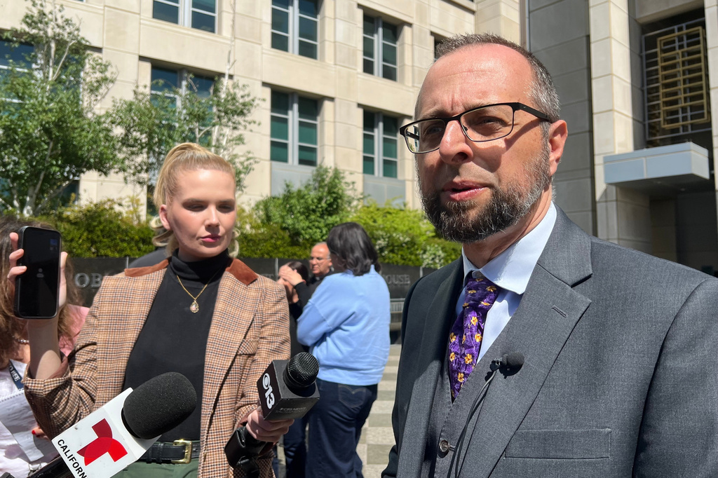 Patrick Kolasinski, an immigration attorney representing Carlos Ivan Mendoza Hernandez, a man shot during an arrest by U.S. Immigration and Customs Enforcement, talks to reporters Tuesday, April 14, 2026, in Sacramento, Calif. (AP Photo/Sophie Austin)