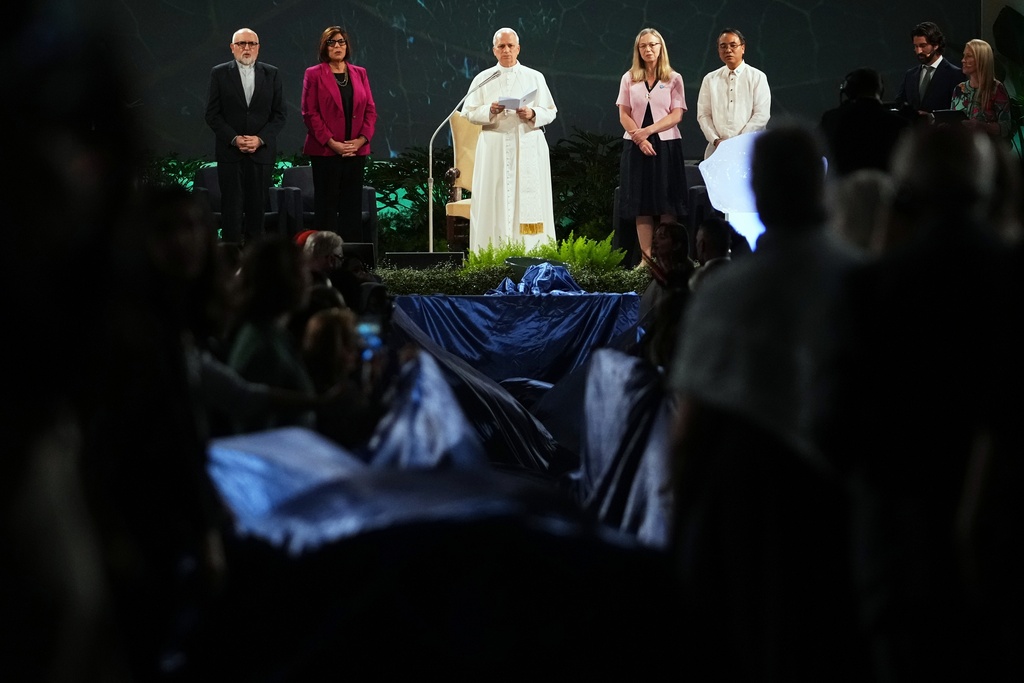 Pope Leo XIV, center, attends the International conference "Raising Hope for Climate Justice", in Castel Gandolfo, Italy, Wednesday, Oct. 1, 2025. (AP Photo/Alessandra Tarantino)
