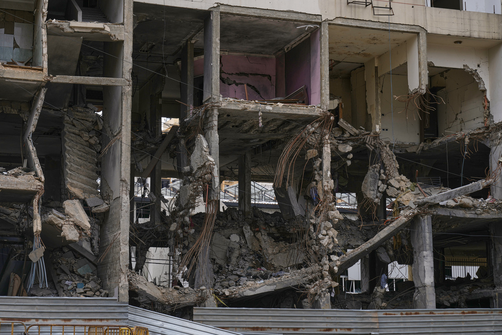 A view of a building damaged in an Israeli airstrike, in Dahiyeh, Beirut's southern suburbs, Beirut's southern suburbs, Lebanon, Monday, March 16, 2026. (AP Photo/Bilal Hussein)