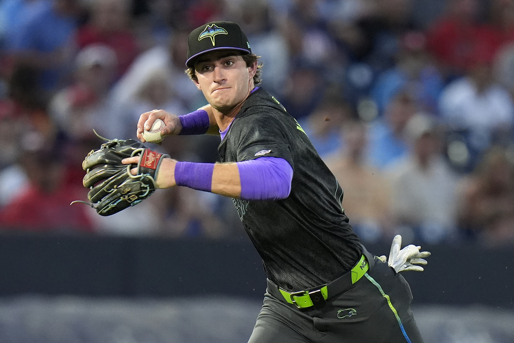 Tampa Bay Rays shortstop Carson Williams throws out St. Louis Cardinals' Thomas Saggese at first base during the second inning of a baseball game Friday, Aug. 22, 2025, in Tampa, Fla. (AP Photo/Chris O'Meara)